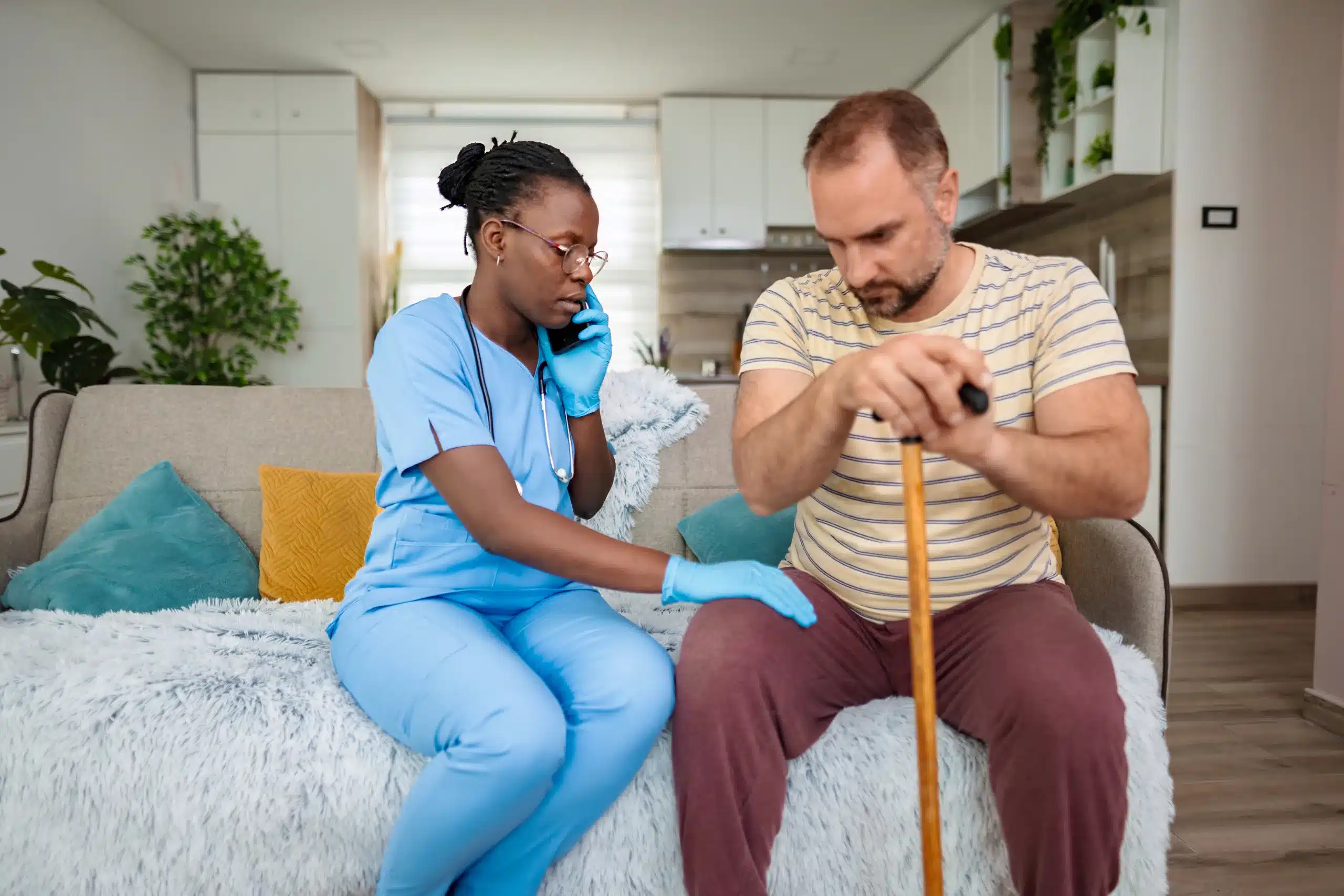 A nurse is taking the blood pressure of an elderly man, highlighting the importance of regular health monitoring.